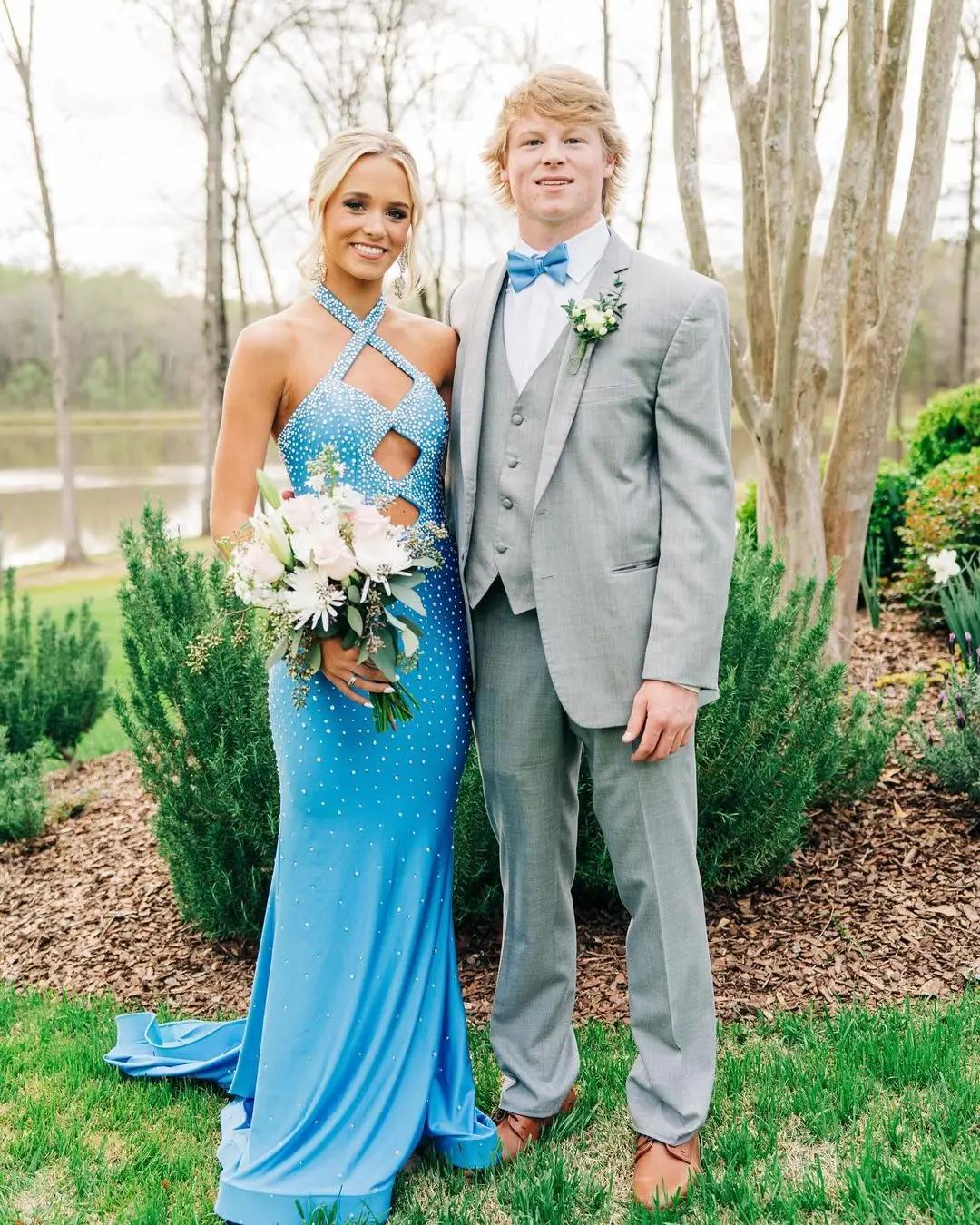 couple at prom girl in blue dress