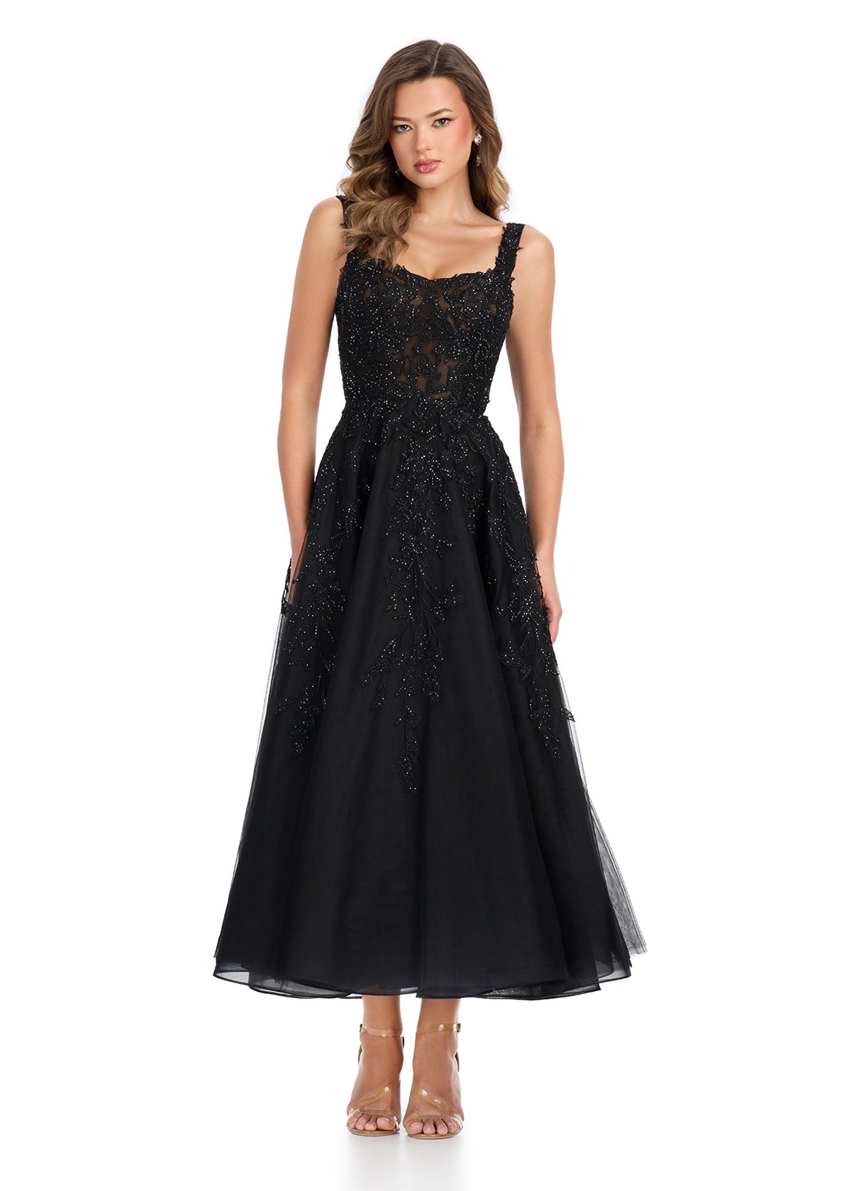 Sophisticated midi-length gown featuring a flattering sweetheart neckline and intricate lace appliqué throughout for a timeless and elegant look. Perfect for special occasions.