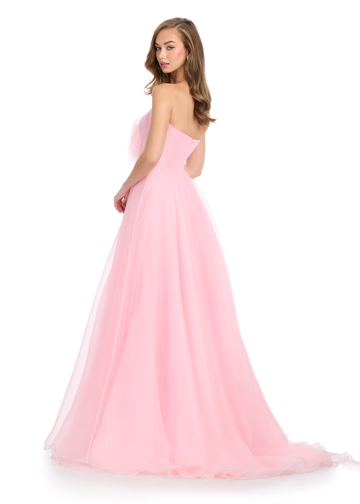 Back -  Enchanting organza ball gown featuring a structured strapless bustier adorned with a delicate organza flower for a feminine and whimsical touch. Perfect for a fairy tale moment at any special occasion.