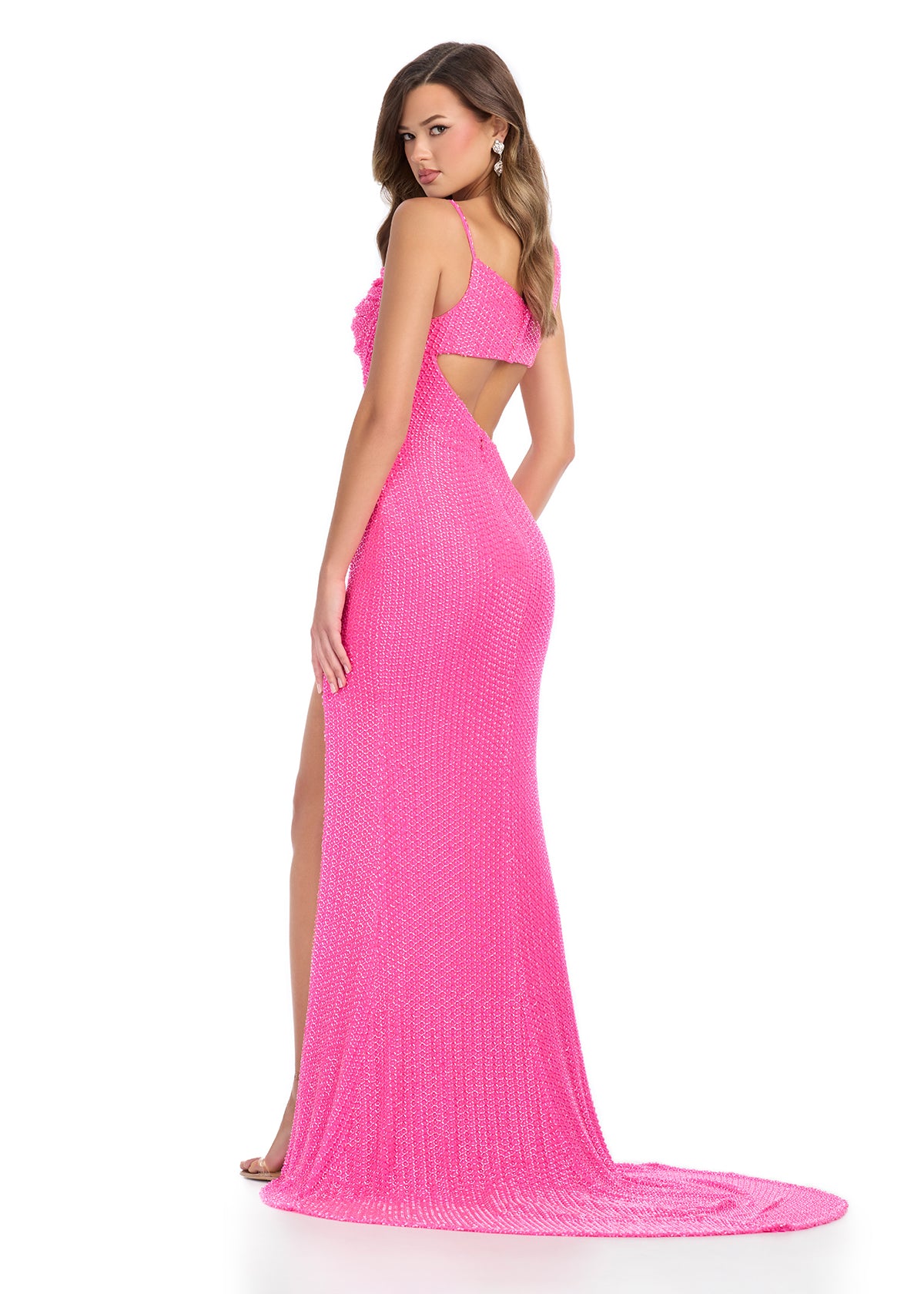 Back -  Striking fully beaded one-shoulder gown featuring elegant draping on the bustier, figure-enhancing cut-outs, a left leg slit, and a sweep train for a showstopping entrance. Perfect for special occasions.