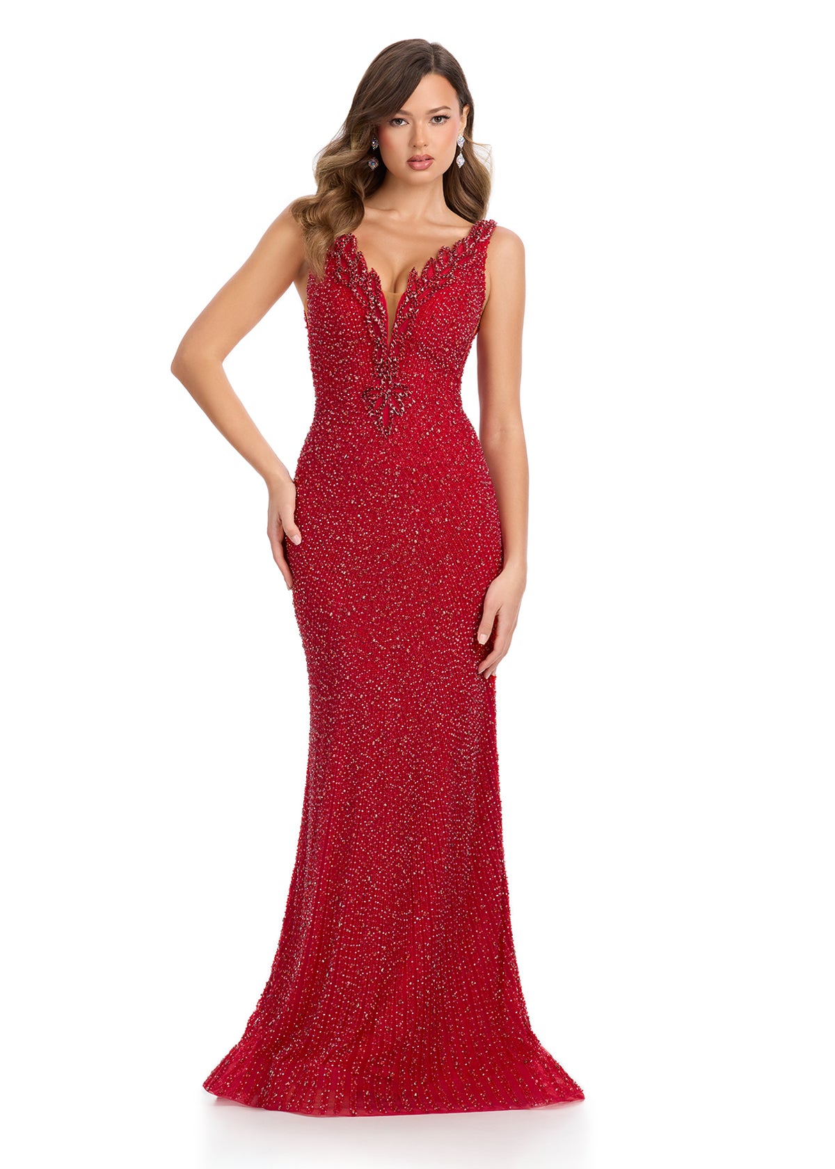 Elegant fitted gown featuring a plunging V-neckline, open V-back, and intricate beadwork that shimmers from every angle. Designed to make a statement at any special occasion.