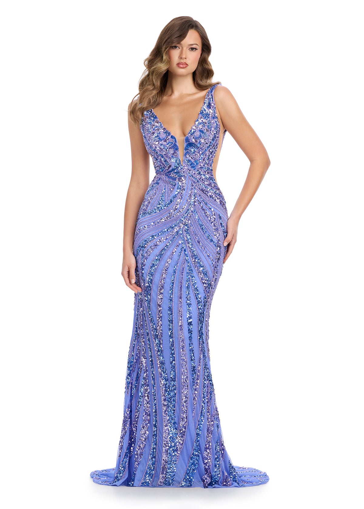 Exquisite fully beaded gown featuring a captivating V-neckline, illusion cut-out mesh sides, and a fitted skirt for a modern and elegant statement. Perfect for special occasions.