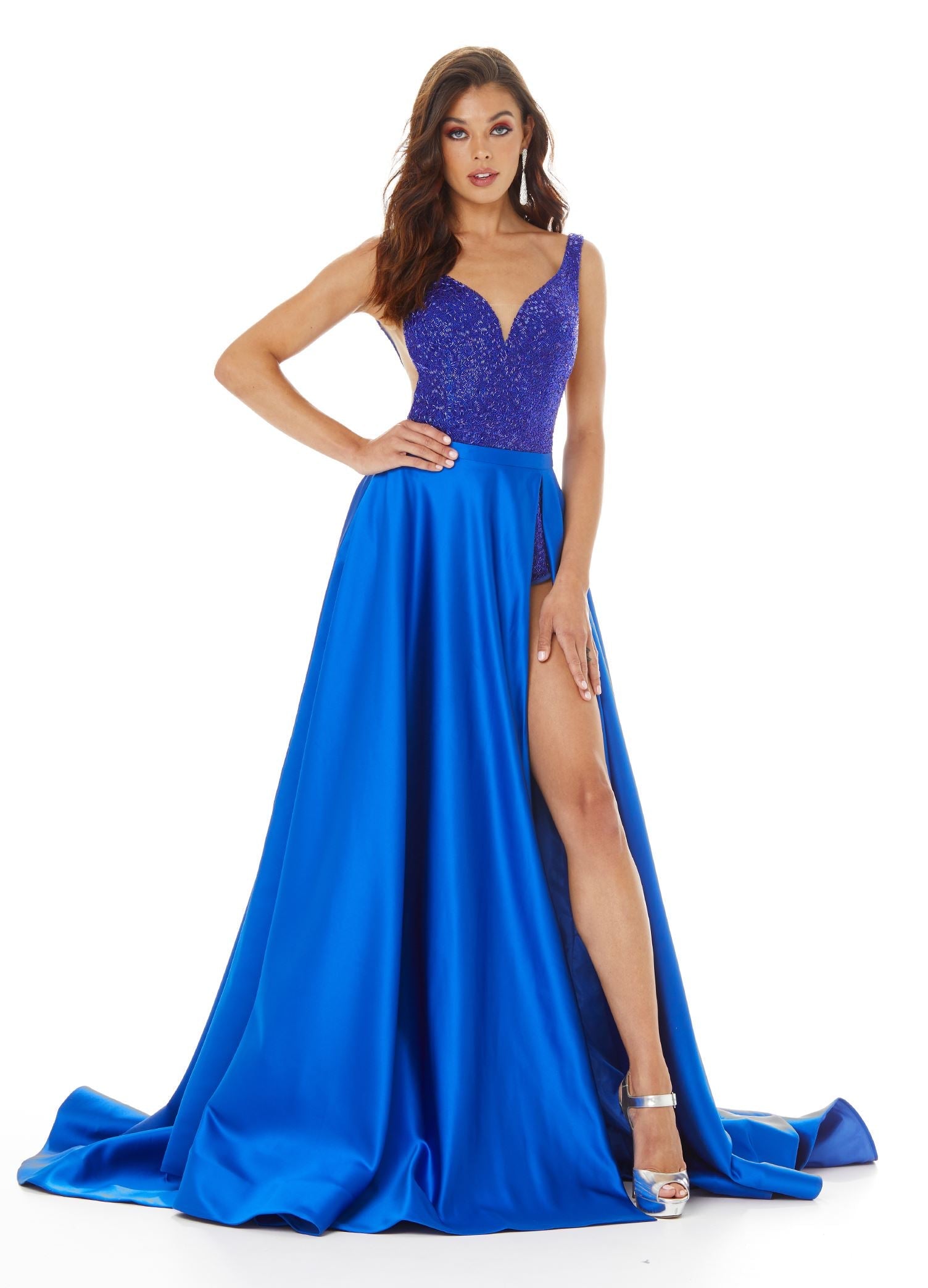 Blue ASHLEYlauren 1997 – A dramatic satin overskirt featuring a left leg slit, horsehair trim, and a sweeping train. Perfect for adding a touch of elegance and flair to your favorite dress, romper, bodysuit, or jumpsuit.