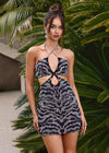 Black ASHLEYlauren 4726 cocktail dress featuring animal print-inspired beadwork, a halter neckline, illusion cut outs, press-on stones, and a fitted skirt for a bold and glamorous look.