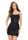 Black ASHLEYlauren 4738 cocktail dress featuring delicate spaghetti straps, a corset bustier adorned with lace applique, and a sleek jersey fitted skirt for an elegant and sophisticated look.