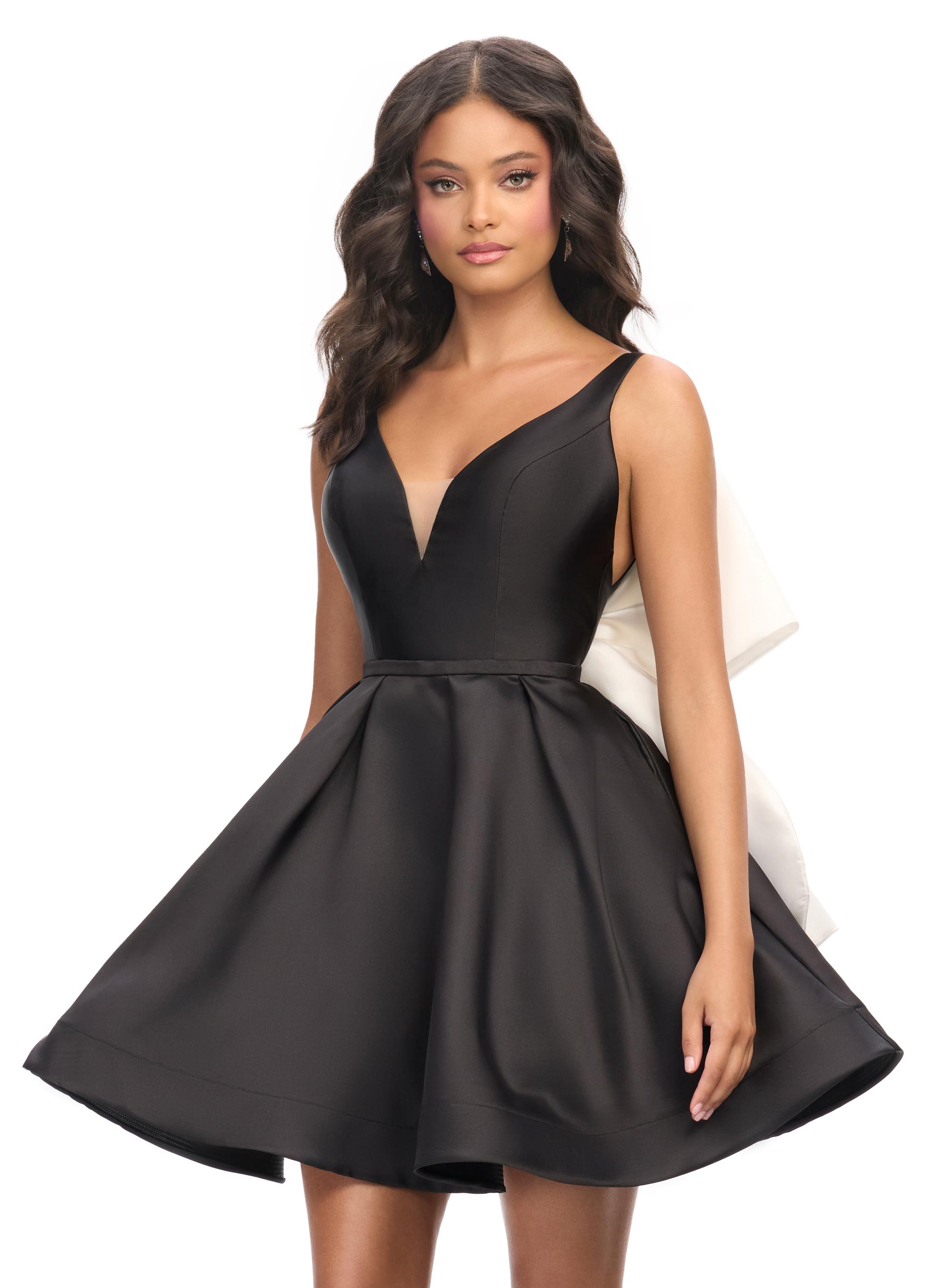 Black ASHLEYlauren 4781 Mikado cocktail dress featuring a deep V-neckline, open back with an inverted bow detail, and an A-line skirt for a chic and elegant statement look.