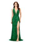 Green ASHLEYlauren 11283 halter gown featuring a V-neckline, open back, intricate beading throughout, and a left leg slit.