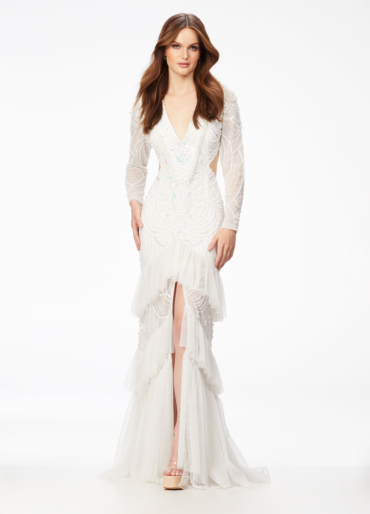 Ivory ASHLEYlauren 11199 – A dramatic v-neck beaded gown featuring long sleeves, ruffle accents, a center slit, and a sweep train. Perfect for making a bold and elegant statement at any special event.



