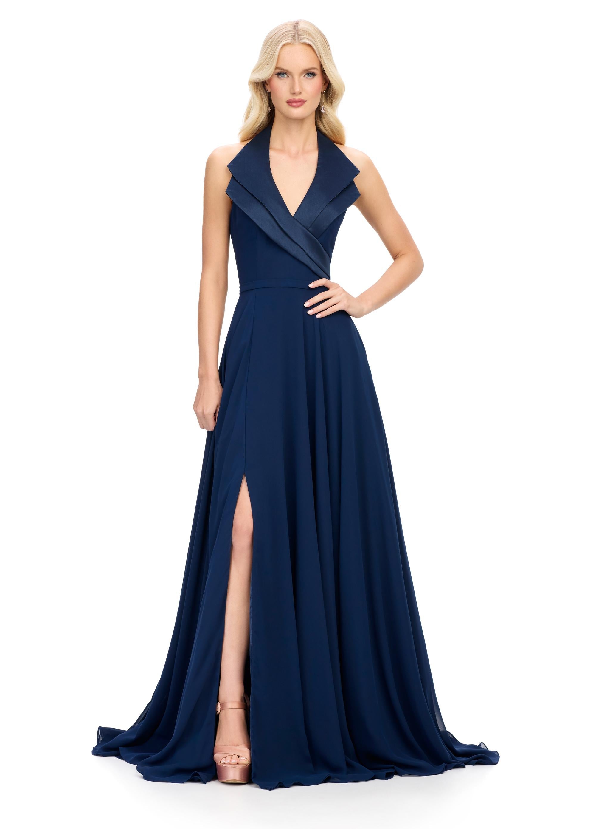 Navy ASHLEYlauren 11753 chiffon gown with structured halter neckline, A-line skirt, and elegant right leg slit — the perfect blend of edge and grace.