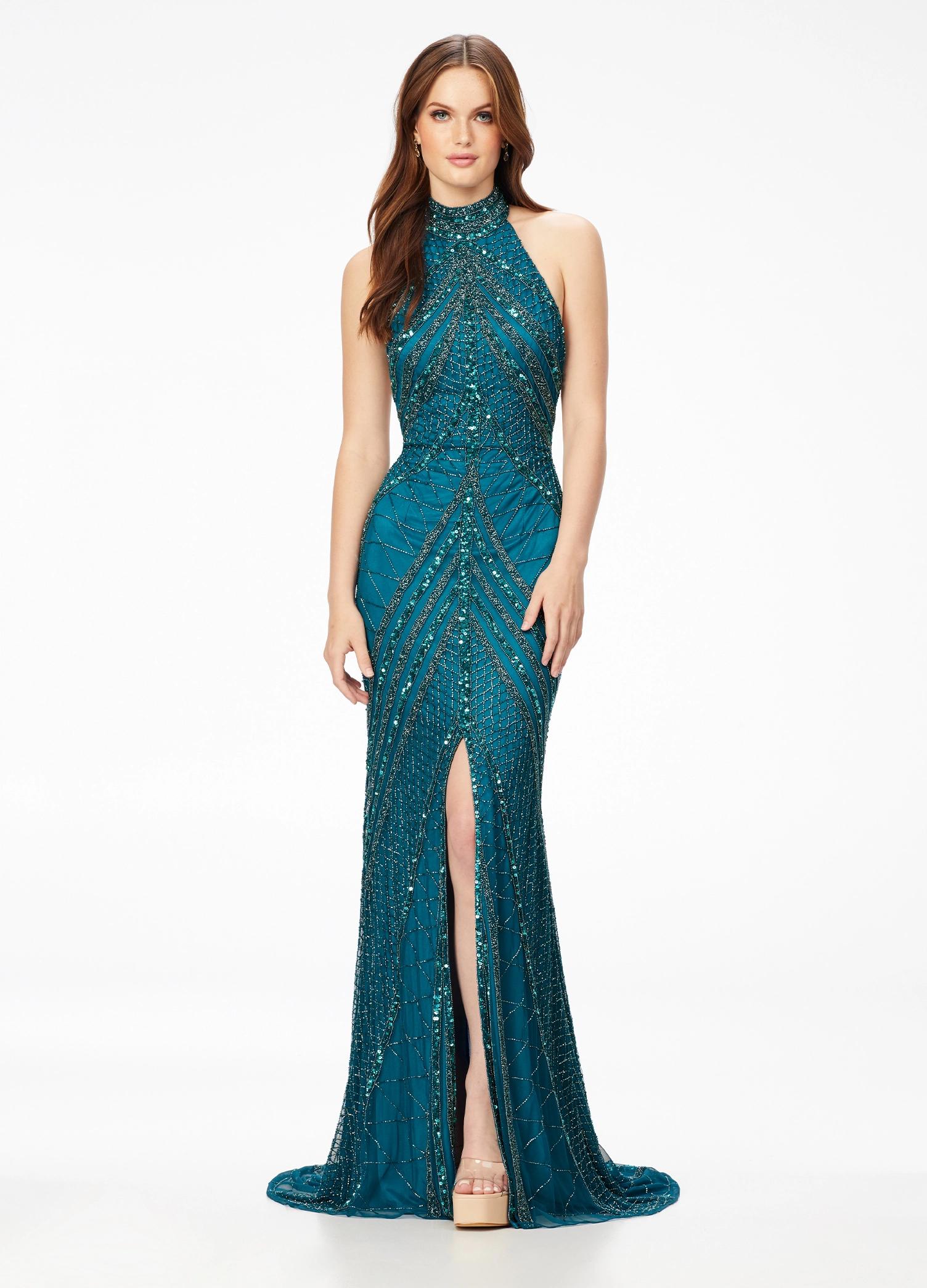 Peacock ASHLEYlauren 11177 – An intricately hand-beaded halter gown featuring a stunning beaded motif, low open back, center slit, and a sweeping train. Perfect for making a show-stopping statement at any event.