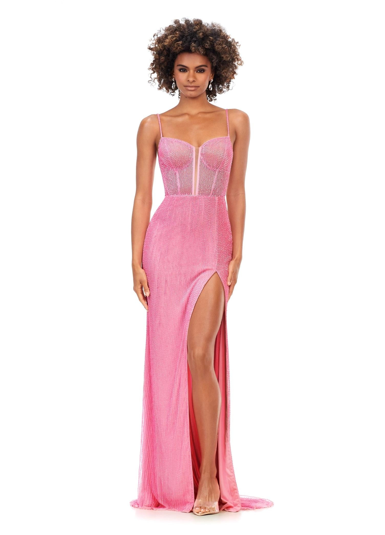 Pink ASHLEYlauren 11369 fully liquid beaded gown featuring an exposed bustier, delicate spaghetti straps, left leg slit, and a sweep train for a glamorous finish.