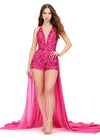 Pink ASHLEYlauren 11386 halter romper featuring a deep V-neckline, open back, and a flowing chiffon overskirt for a chic and elegant look.