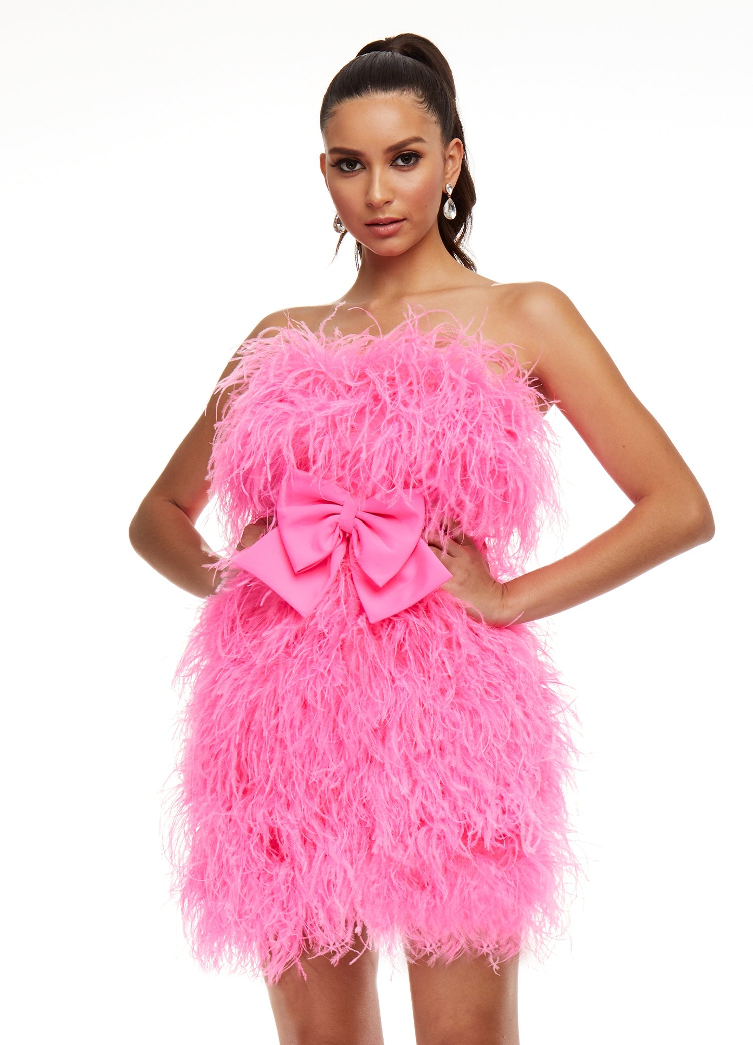 Pink ASHLEYlauren 4467 strapless cocktail dress featuring a fully feathered design and an oversized bow detail at the waist for a flirty and standout look.