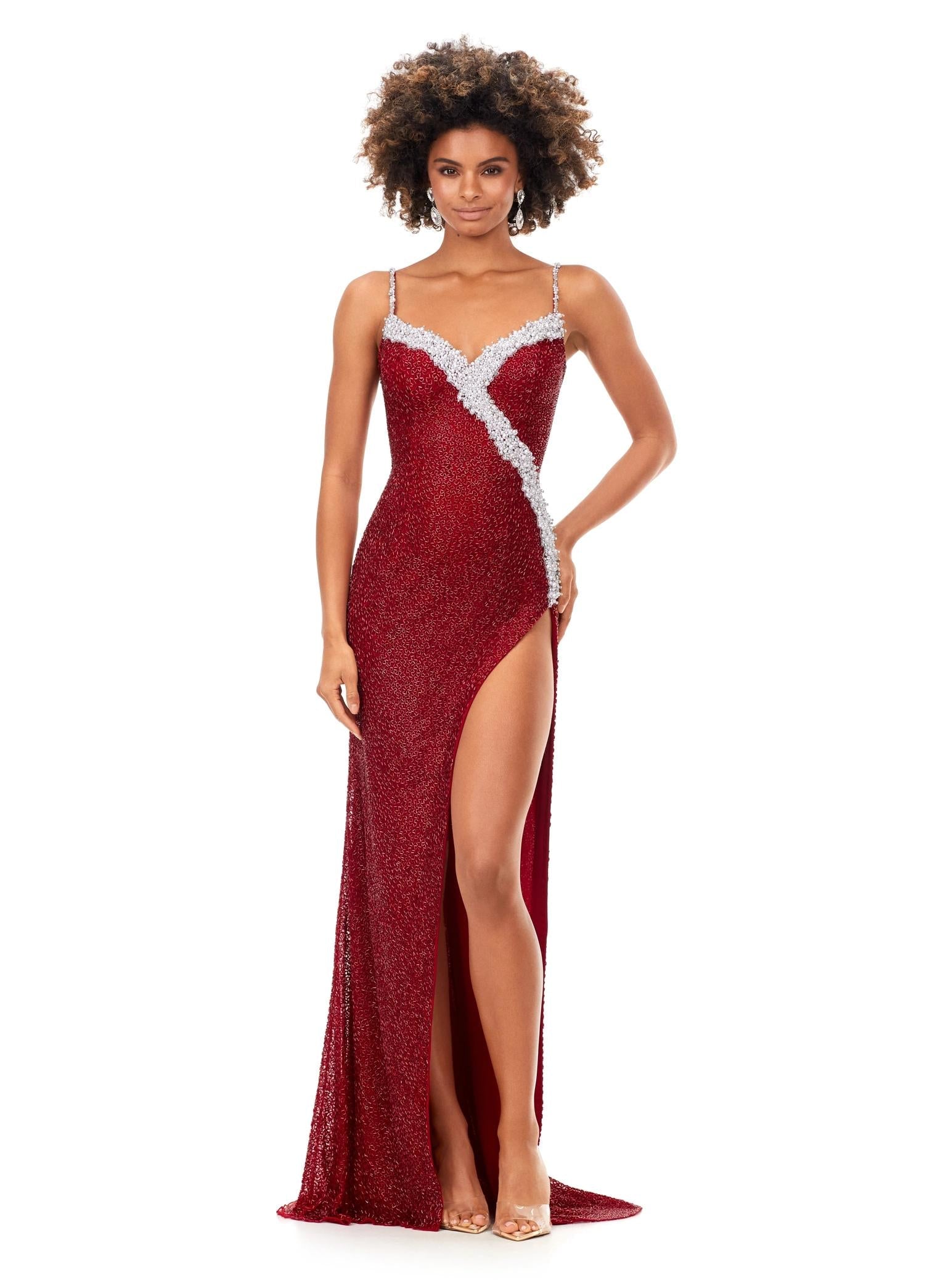 Red ASHLEYlauren 11368 gown featuring a sweetheart neckline, delicate spaghetti straps, ivory pearl and crystal beading across the bustier, and a left leg slit for an elegant finish.