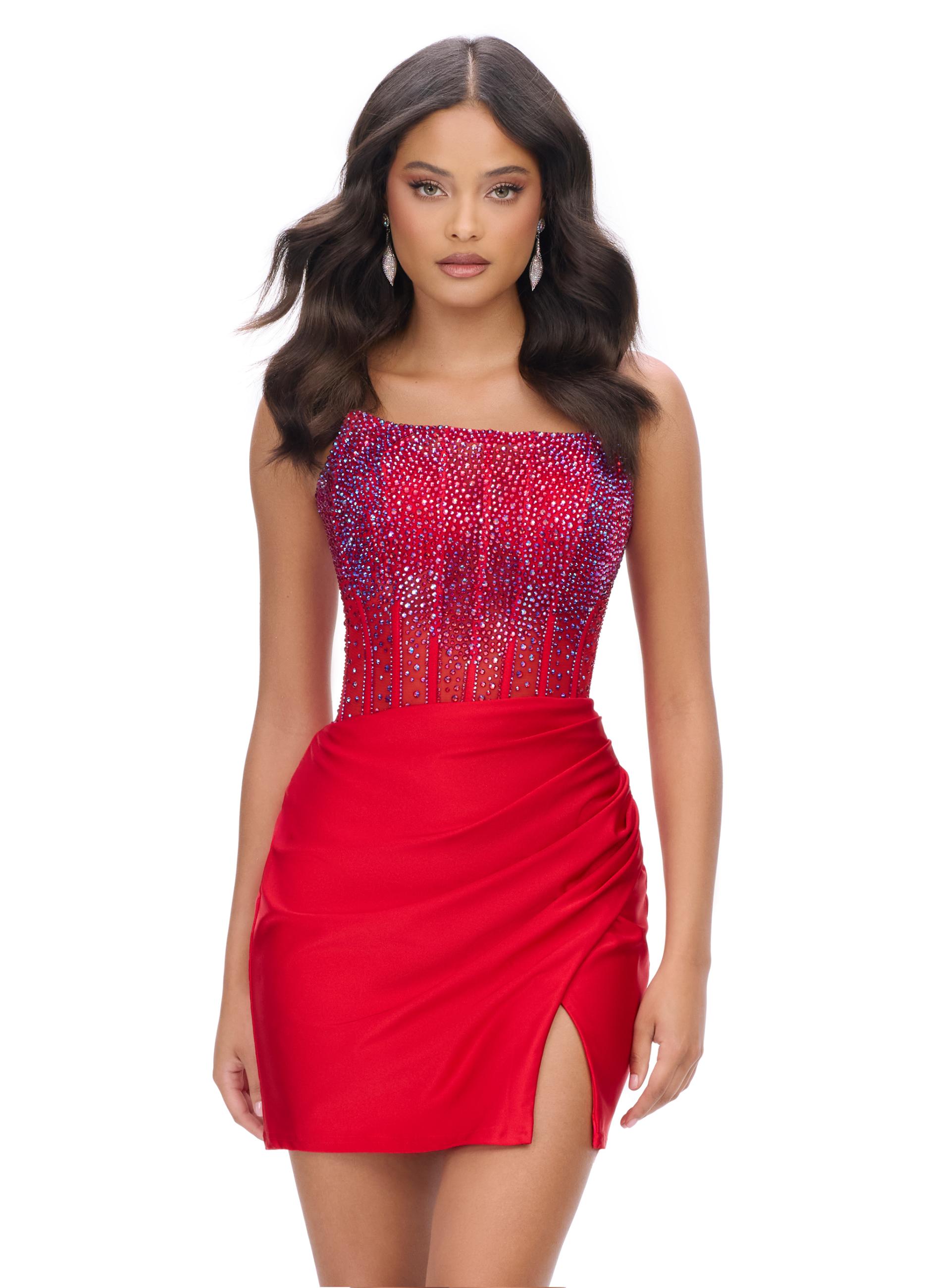 Red ASHLEYlauren 4686 strapless cocktail dress featuring a corset bustier embellished with press-on stones, a sleek jersey skirt, and a left leg slit for a classic and glamorous look.