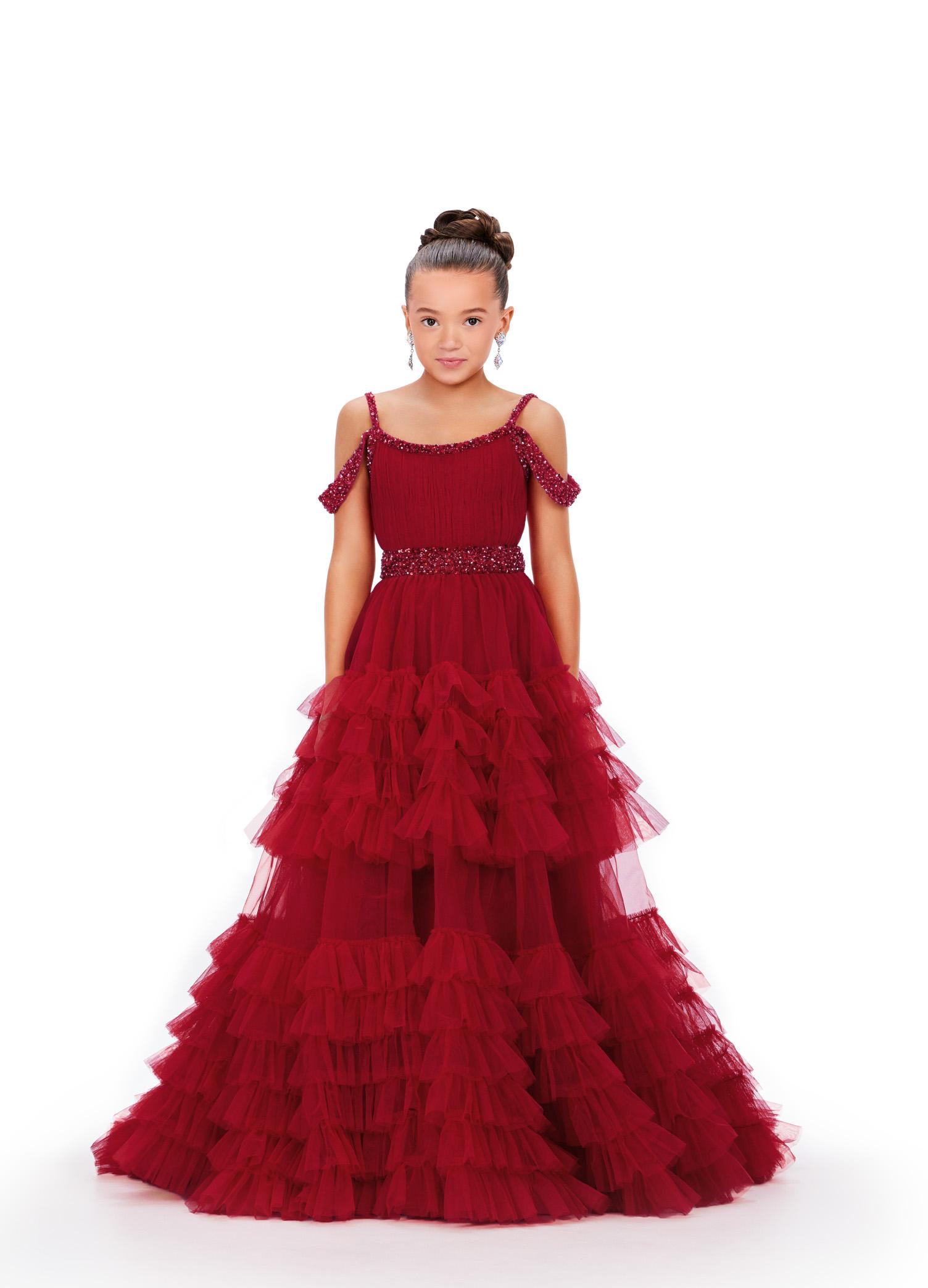 Red ASHLEYlauren 8261 kids ball gown featuring a beaded scoop neckline, V-back, off-the-shoulder draping straps, and a dramatic tiered tulle skirt with a sweeping train for an enchanting and elegant look.