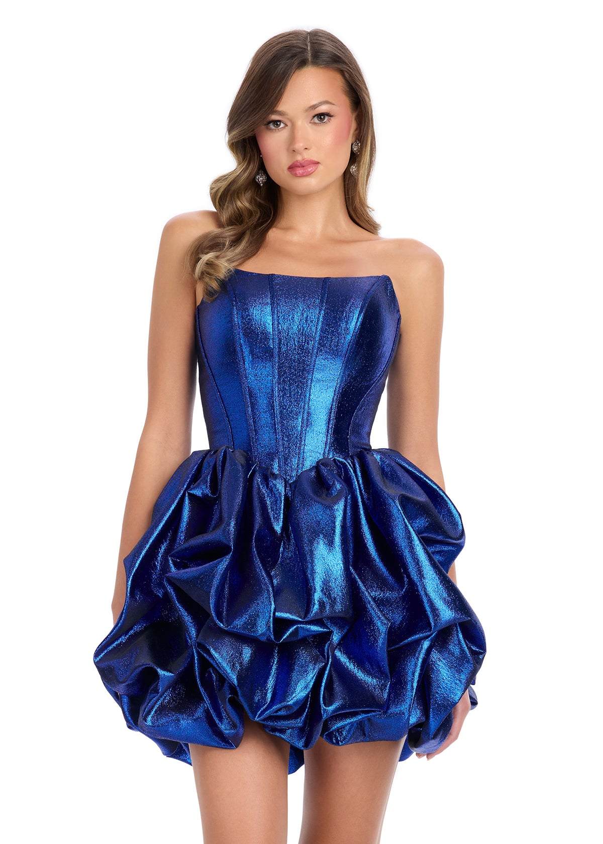 ASHLEYlauren 4789 – A stunning strapless metallic cocktail dress with corset detailing, a pick-up skirt, and a full ruffle design. Perfect for making a fabulous statement at your next event.