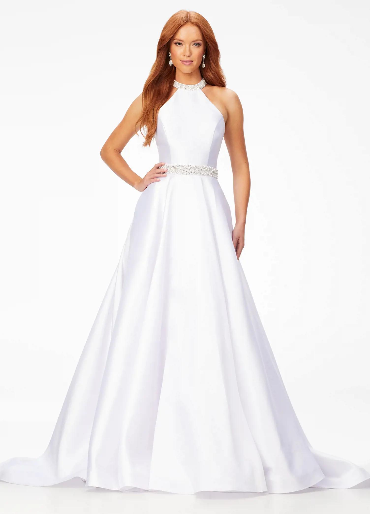 White ASHLEYlauren 11230 – A stunning A-line mikado gown featuring a crystal and pearl encrusted halter bustier and waistline, paired with a full ball gown skirt. Perfect for making an elegant statement at your next event.