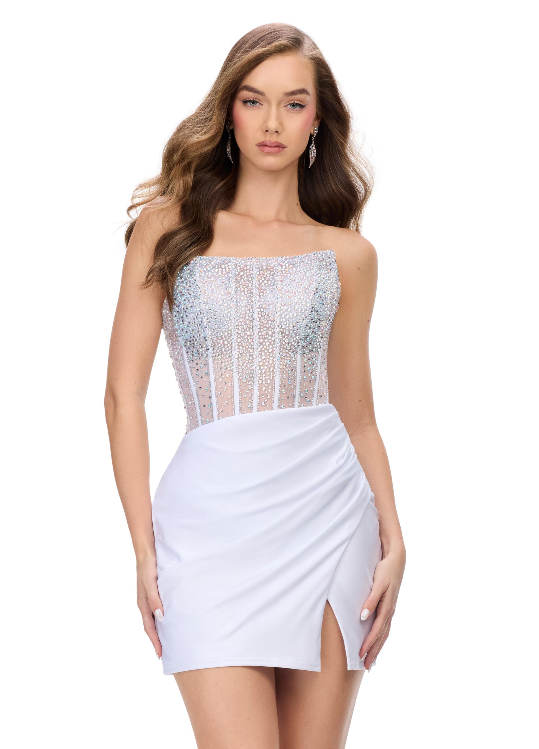 White ASHLEYlauren 4686 strapless cocktail dress featuring a corset bustier embellished with press-on stones, a sleek jersey skirt, and a left leg slit for a classic and glamorous look.