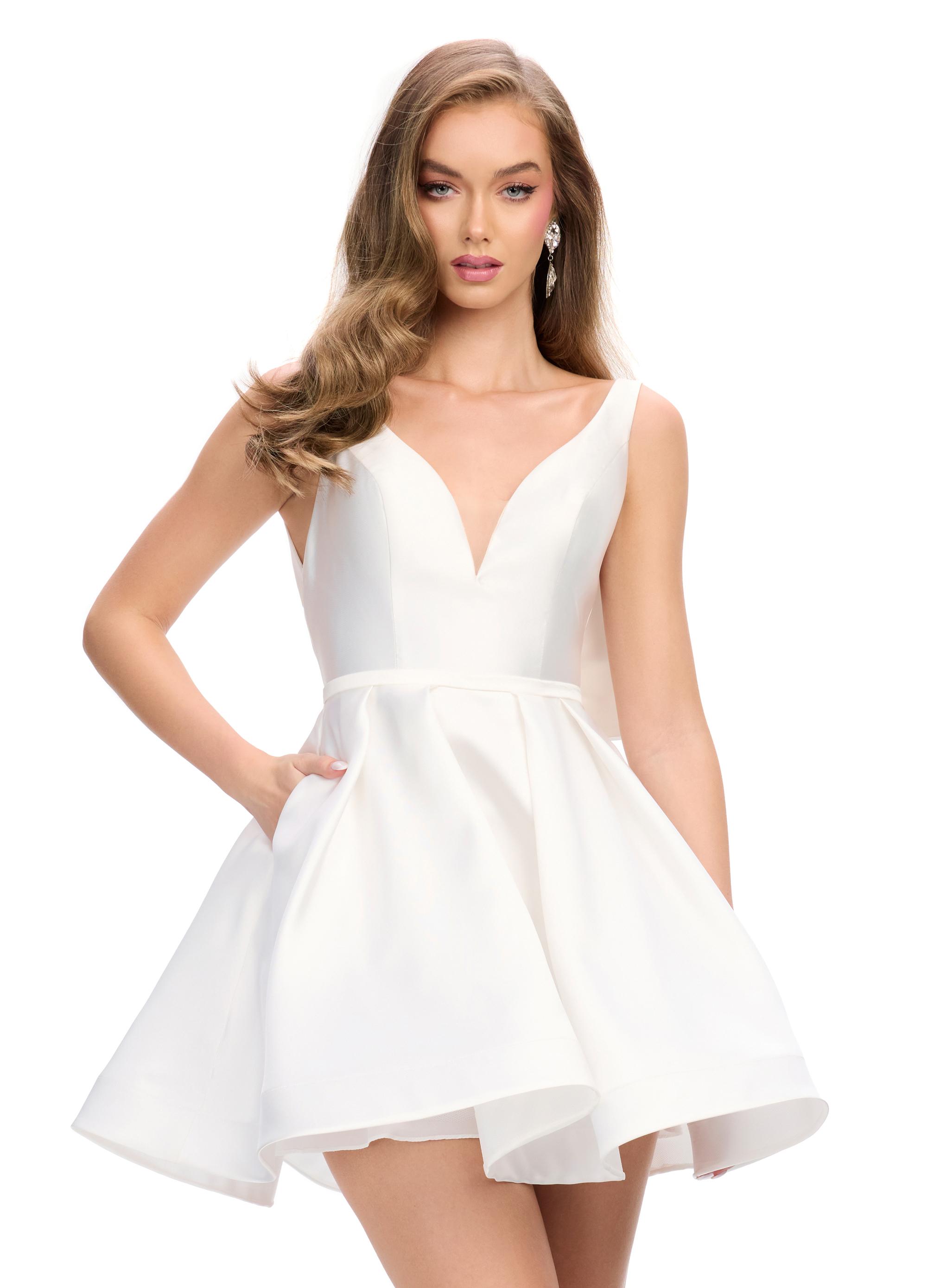 White ASHLEYlauren 4781 Mikado cocktail dress featuring a deep V-neckline, open back with an inverted bow detail, and an A-line skirt for a chic and elegant statement look.