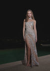 Video -  Luxurious fully beaded gown featuring a chic strapless neckline, a sophisticated beaded collar, and a right leg slit. Designed with intricate hand-beaded patterns that sparkle with every movement for an unforgettable look.